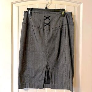 Black pinstripe pencil skirt with lace-up detail on back.